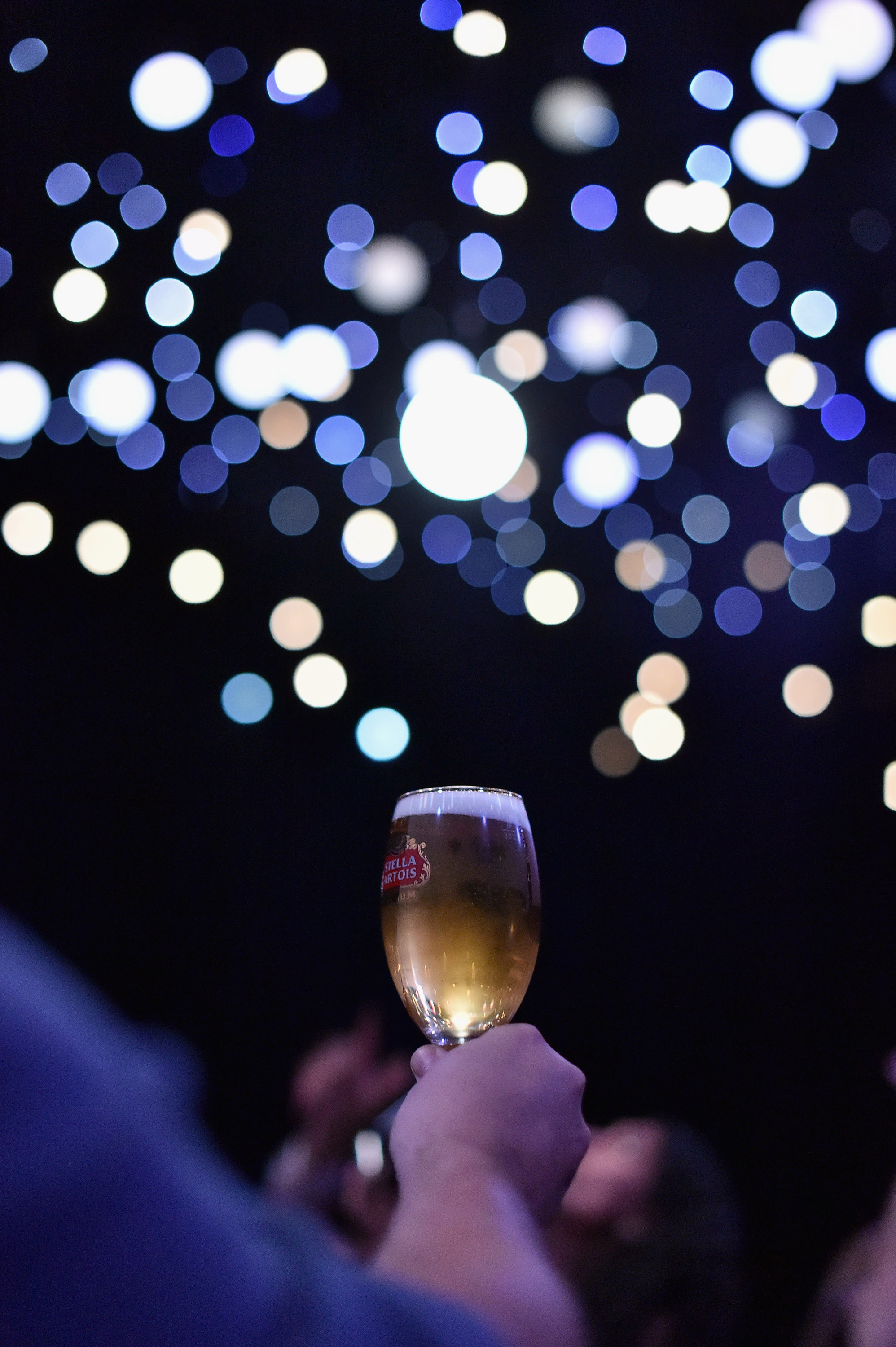 NEW YORK, NY - DECEMBER 09: Guests enjoy the interactive light installation, "Stars" by Stella Artois on opening night in New York City where John Legend performed his exclusive new holiday song, "Under the Stars," on December 9, 2015. To listen, visit StellaArtois.com. (Photo by Mike Coppola/Getty Images for Stella Artois)