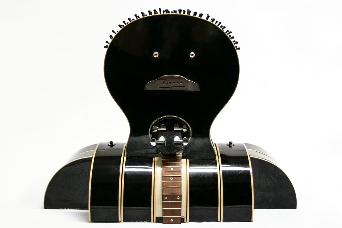 “Two-Faced Blues” (2021), Yamaha acoustic-electric guitar parts, 23 x 29 x 15 1/2 inches.