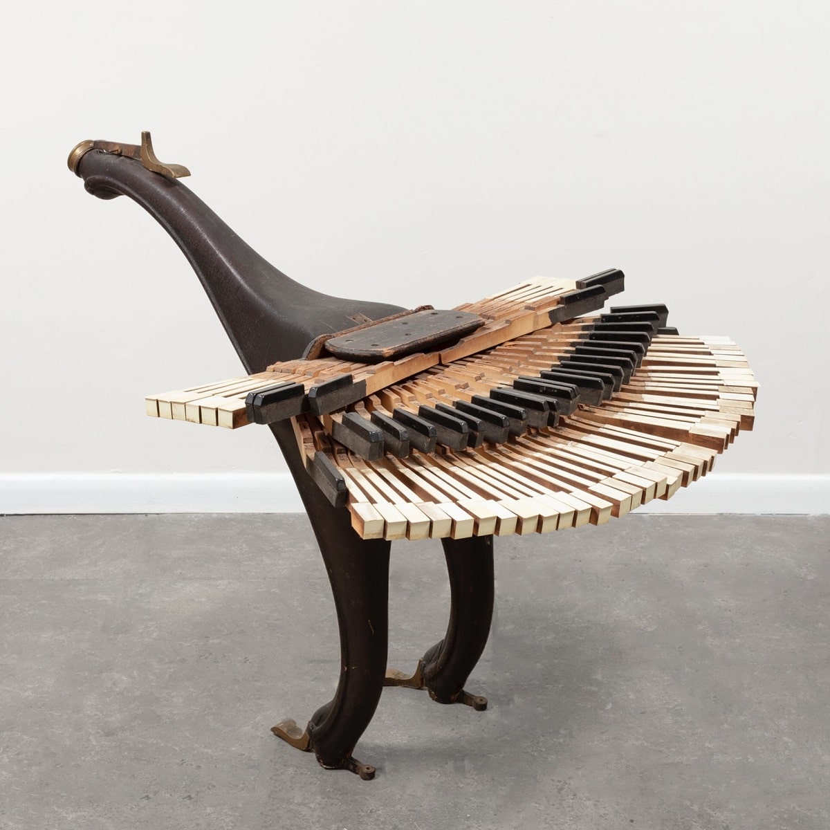 “Piano Bird” (2021), piano legs, keys, and wiring, 34 x 32 1/2 x 42 inches.
