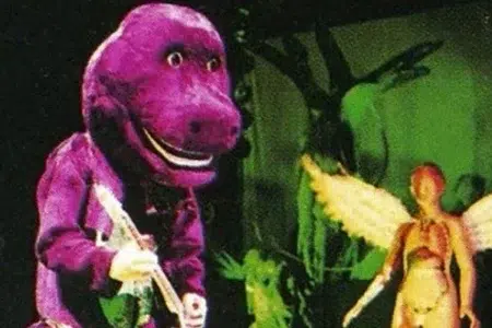 KURT COBAIN TOCANDO DISFRAZADO DE BARNEY